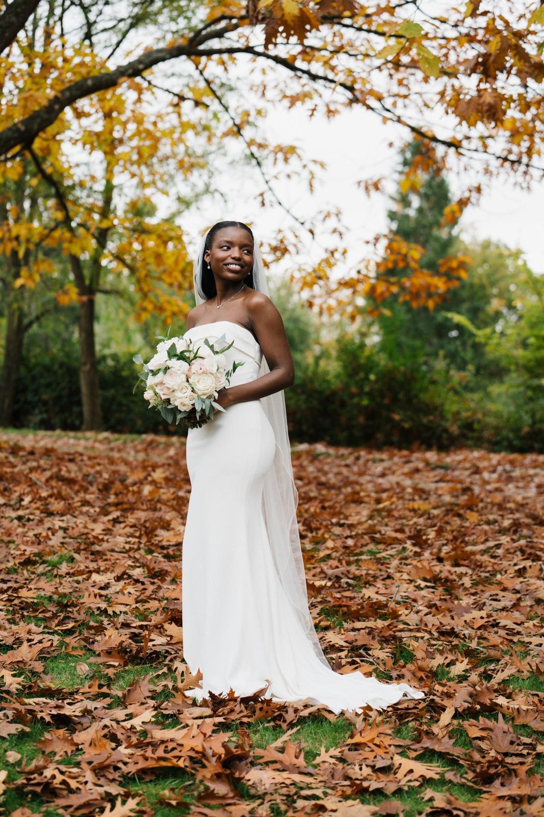 Sandra wearing the dress outdoors, showing the full front silhouette in natural light