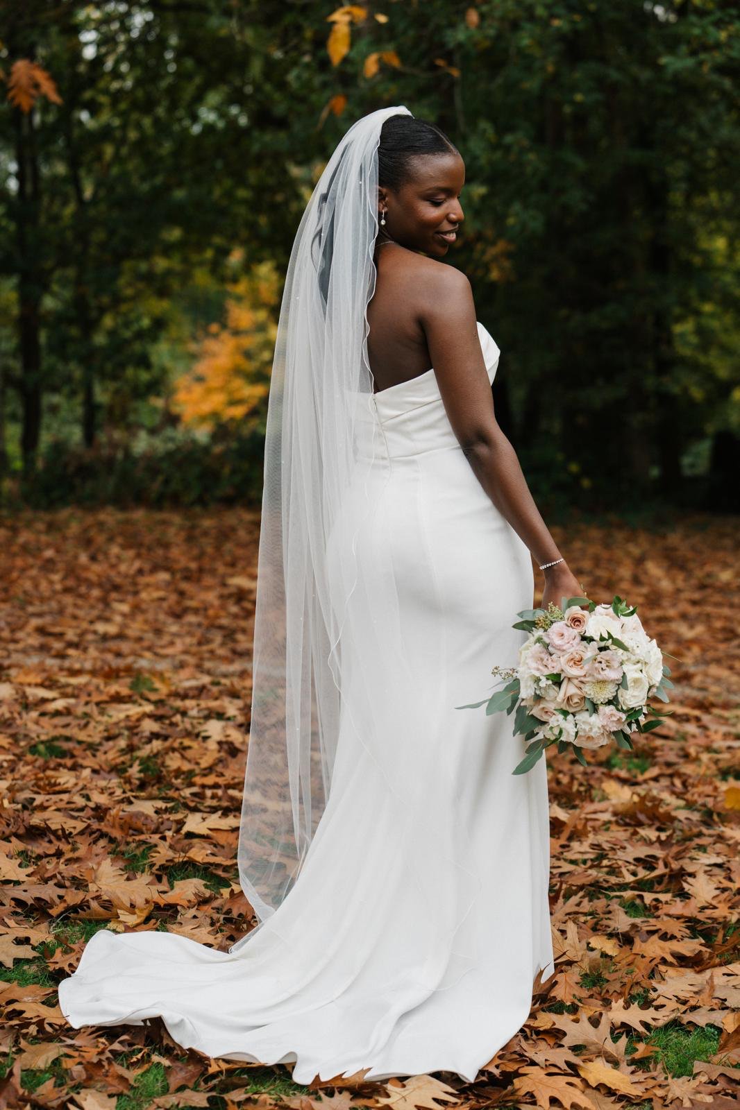 Back view of Sandra wearing the dress with the veil and train