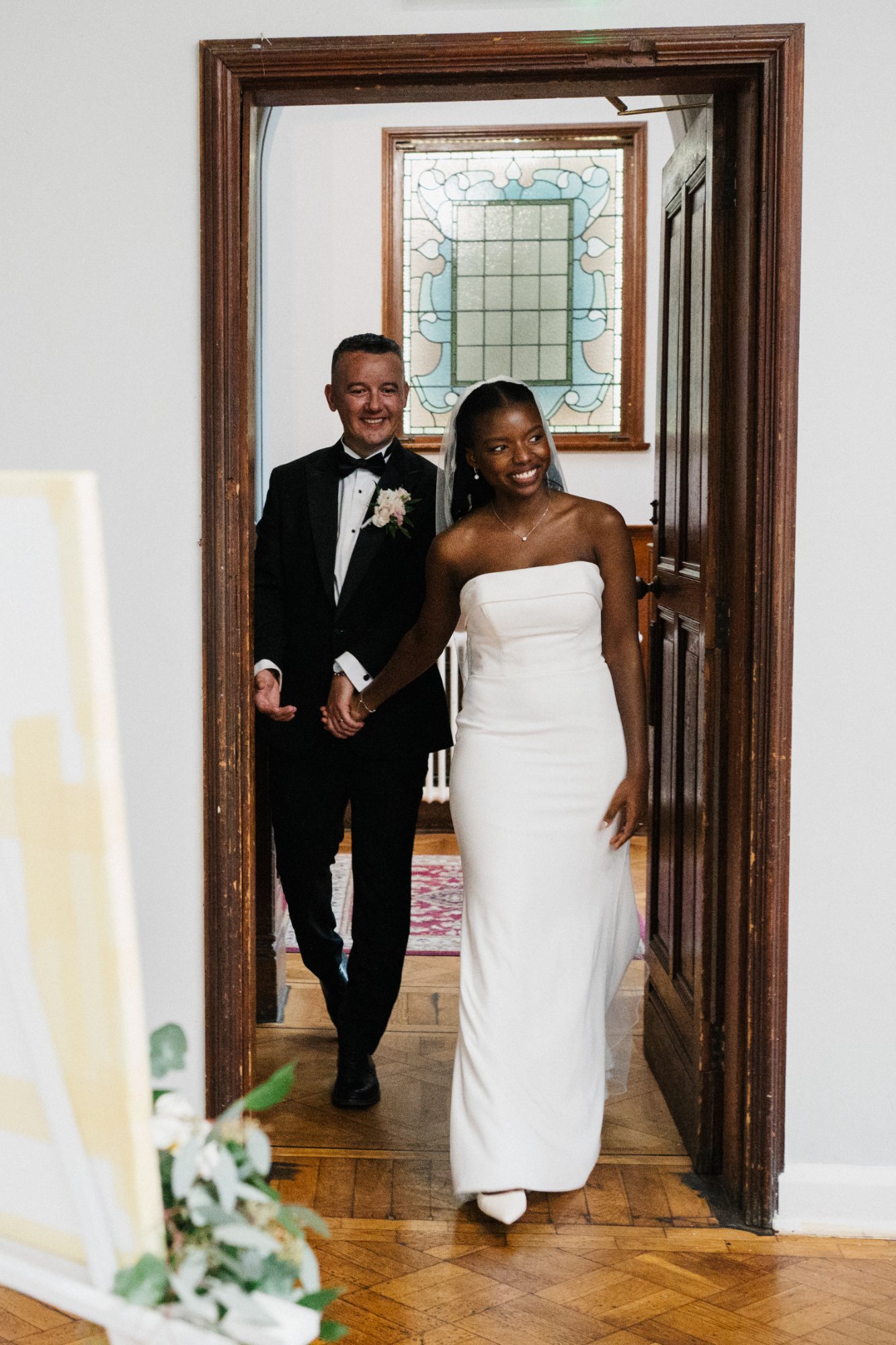 Sandra in the dress in a doorway, showing movement and shape